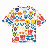 Colorful floral patterned t-shirt on a white background