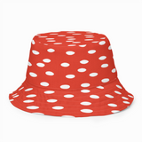 Red bucket hat with white polka dots on a white background