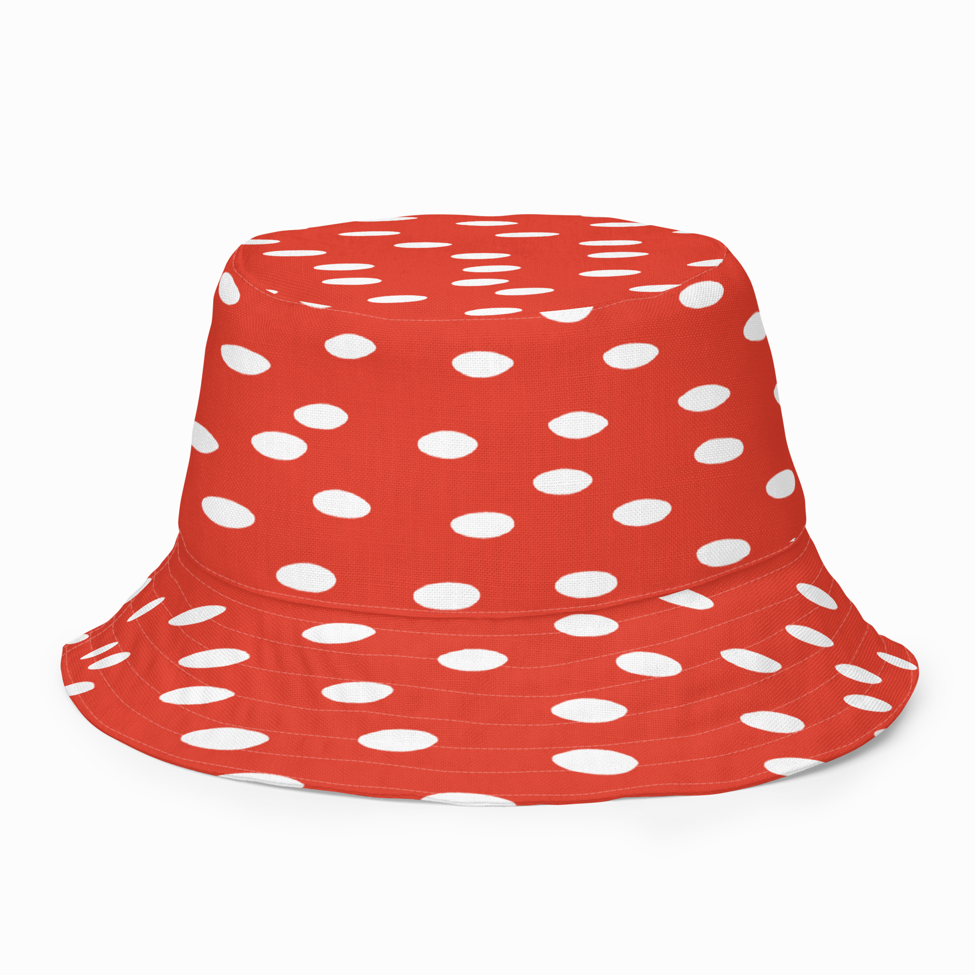 Red bucket hat with white polka dots on a white background