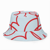 Bucket hat with red abstract patterns on a light blue background