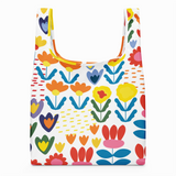 Reusable shopping bag with colorful floral pattern on a white background