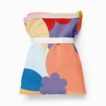Colorful dress with geometric patterns on a white background
