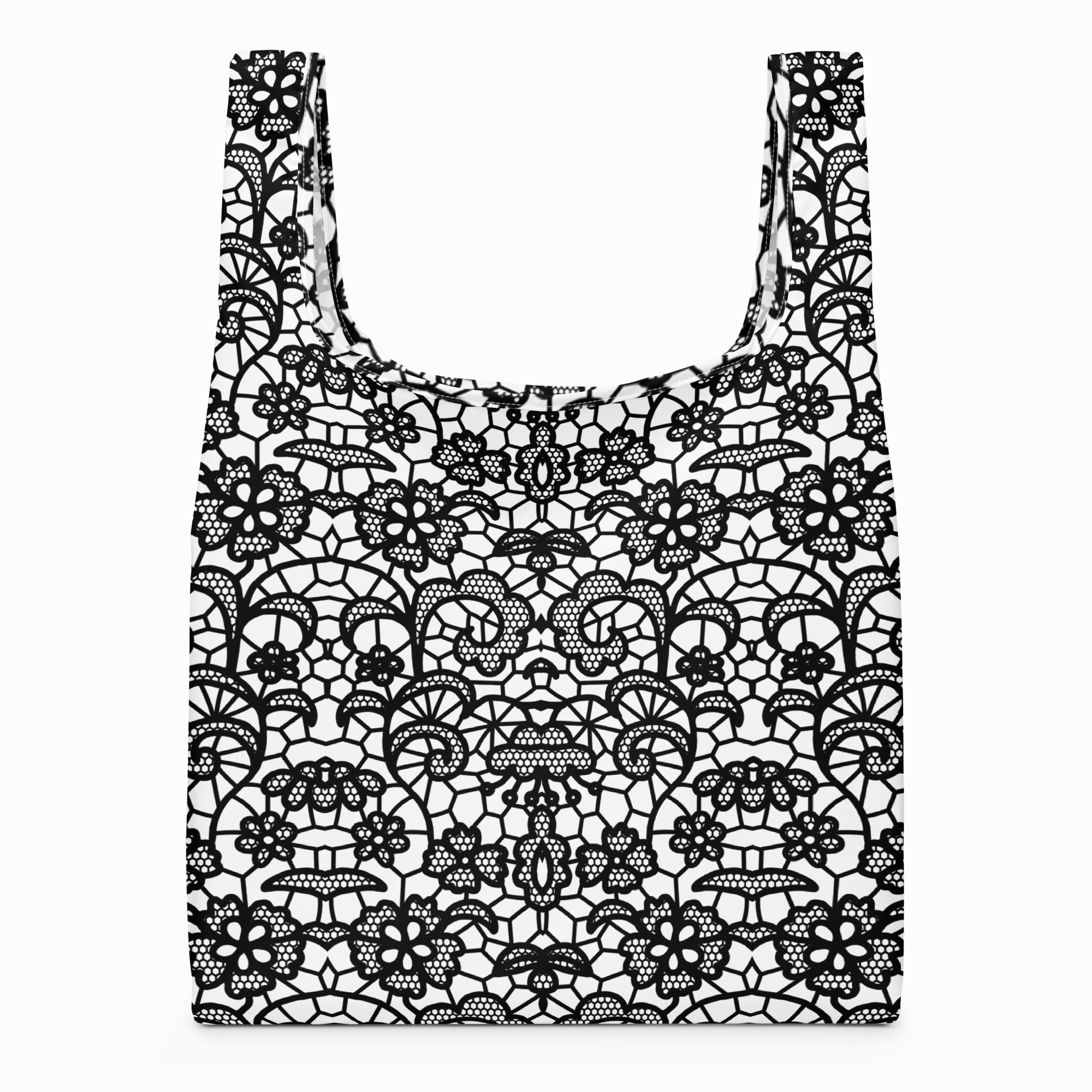 A reusable tote bag with a black and white lace floral pattern, shown against a plain white background.