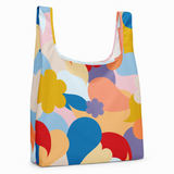 Colorful reusable bag with abstract floral design on a white background