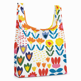 Reusable shopping bag with colorful floral pattern on a white background