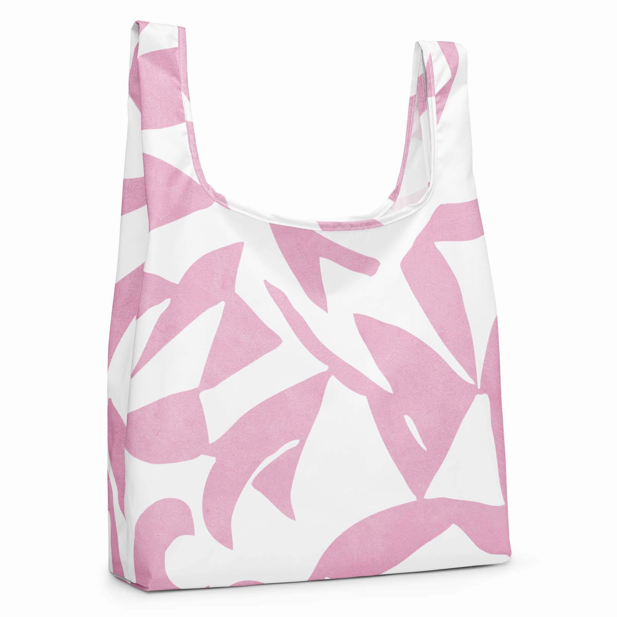 A reusable tote bag with a bold pink and white abstract floral pattern, shown on a clean white background.