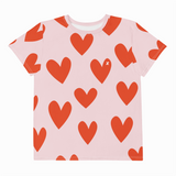 Pink t-shirt with red heart pattern on a white background