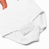 White baby onesie with button details on a light gray background