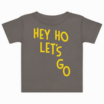 Gray t-shirt with yellow text 'HEY HO LET'S GO' on a white background