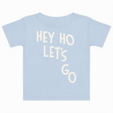 Light blue t-shirt with 'HEY HO LET'S GO' text on a white background
