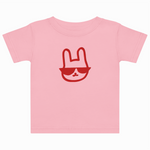 Pink t-shirt with a red graphic of a face wearing sunglasses on a white background