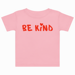 Pink t-shirt with 'BE KIND' text on a white background