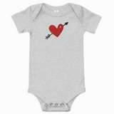 Gray baby onesie with a red heart and arrow design on a white background