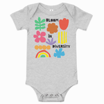 Athletic heather gray baby short-sleeve one-piece bodysuit with colorful "Bloom in Diversity" graphic featuring flowers, a leaf, a rainbow, and abstract shapes.
