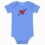 Blue baby onesie with a red heart and arrow design on a white background