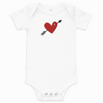 White baby onesie with a red heart and black arrow design on a white background