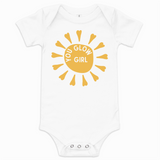 White baby onesie with yellow sun design and 'Glow Girl' text on a white background