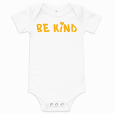 White baby short-sleeve one-piece bodysuit with yellow hand-lettered "Be Kind" graphic and small heart above the "i" on the front.