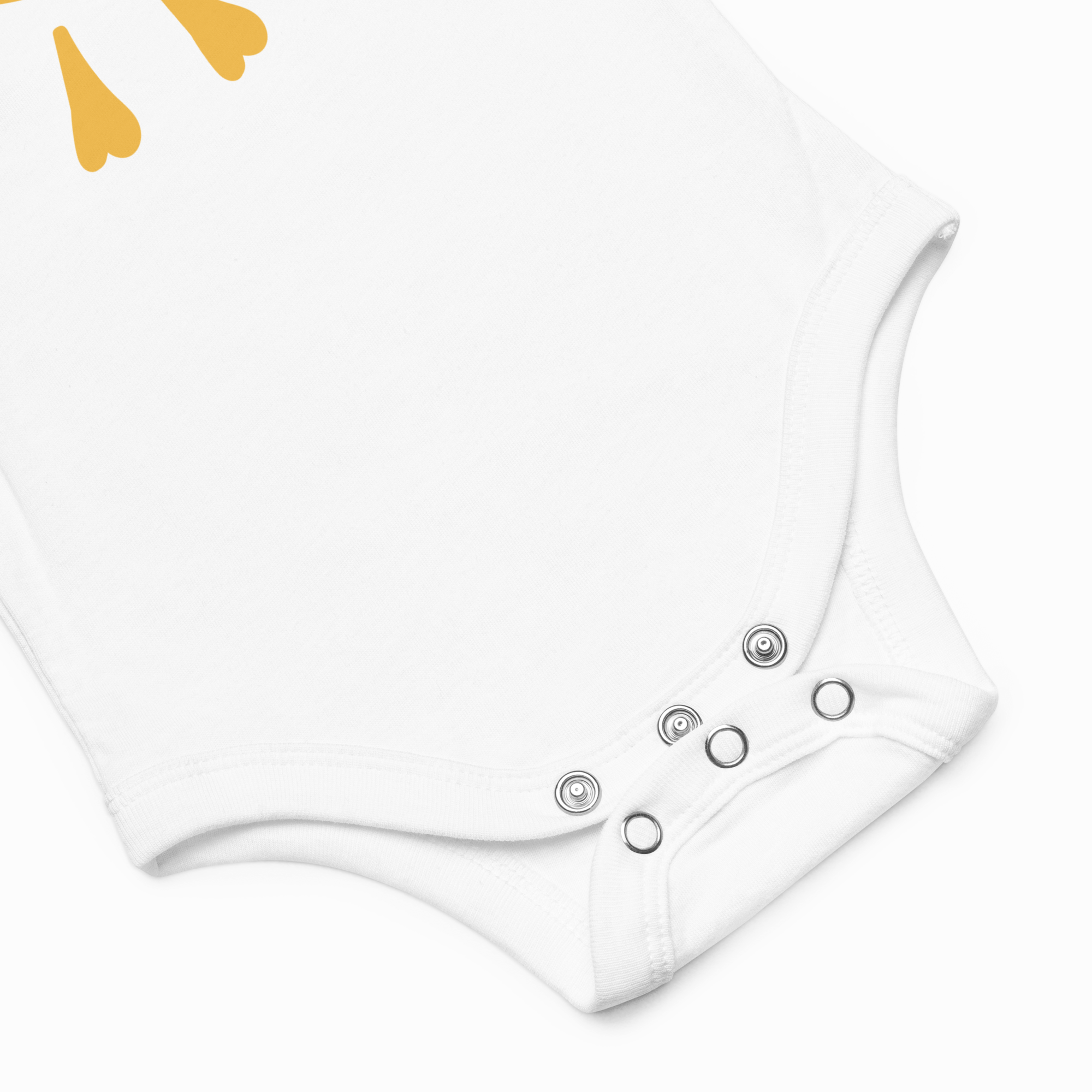 White baby romper with button details on a light gray background