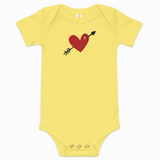Yellow baby onesie with a red heart and black arrow design on a white background