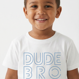 Child wearing a white t-shirt with 'DUDE BRO' text on a plain background
