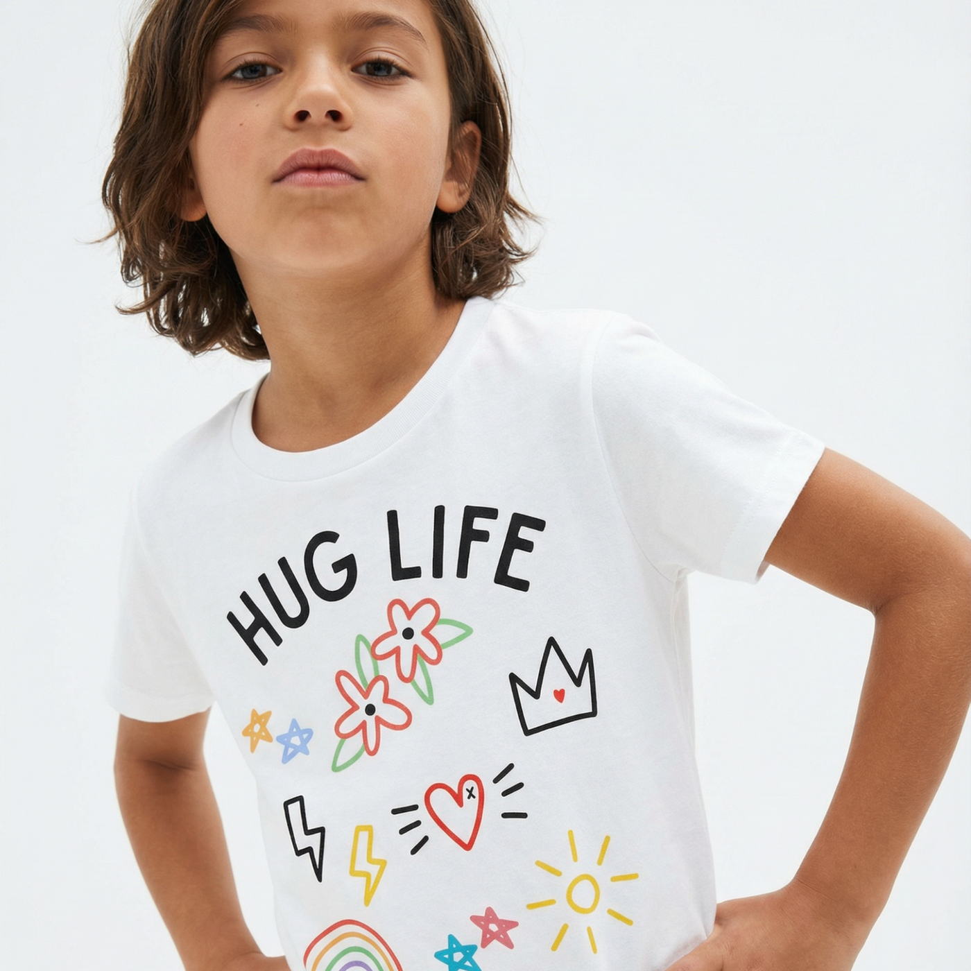 Child wearing a white t-shirt with 'HUG LIFE' and colorful graphics on a plain background