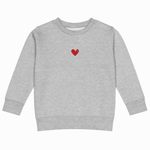 Gray sweatshirt with 'TOGA' printed on it against a white background