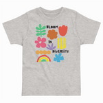 Heather gray toddler T-shirt with colorful "Bloom in Diversity" graphic featuring flowers, leaves, a rainbow, and abstract shapes.
