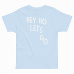 Light blue t-shirt with 'HEY HO LET'S GO' text on a white background