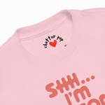 Pink t-shirt with text and a heart design on a white background