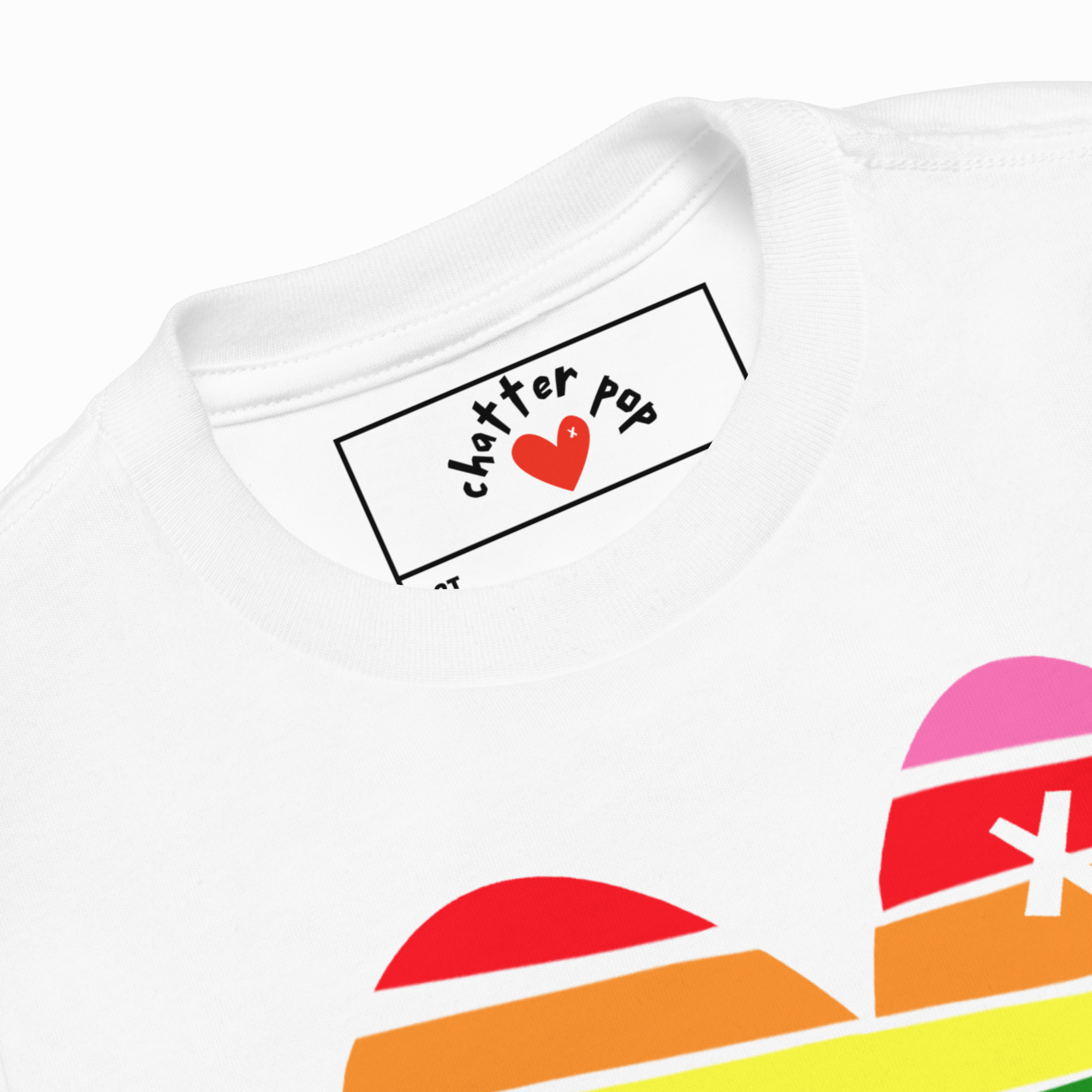 White t-shirt with colorful design and 'Chatter Pop' logo on a white background