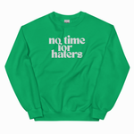 A bright green crewneck sweatshirt with the phrase 'no time for haters' printed in white retro-style text across the chest, displayed on a clean white background.