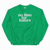 A bright green crewneck sweatshirt with the phrase 'no time for haters' printed in white retro-style text across the chest, displayed on a clean white background.