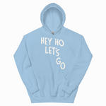Light blue hoodie with 'HEY HO LET'S GO' text on a white background