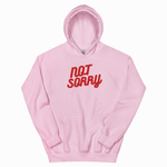 A light pink pullover hoodie with the words 'NOT SORRY' printed in red across the chest, displayed on a clean white background.