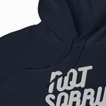 Close-up of a dark navy hoodie with a white graphic text print reading 'NOT SORRY' and black drawstrings, shown against a plain white background.