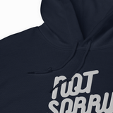 Close-up of a dark navy hoodie with a white graphic text print reading 'NOT SORRY' and black drawstrings, shown against a plain white background.