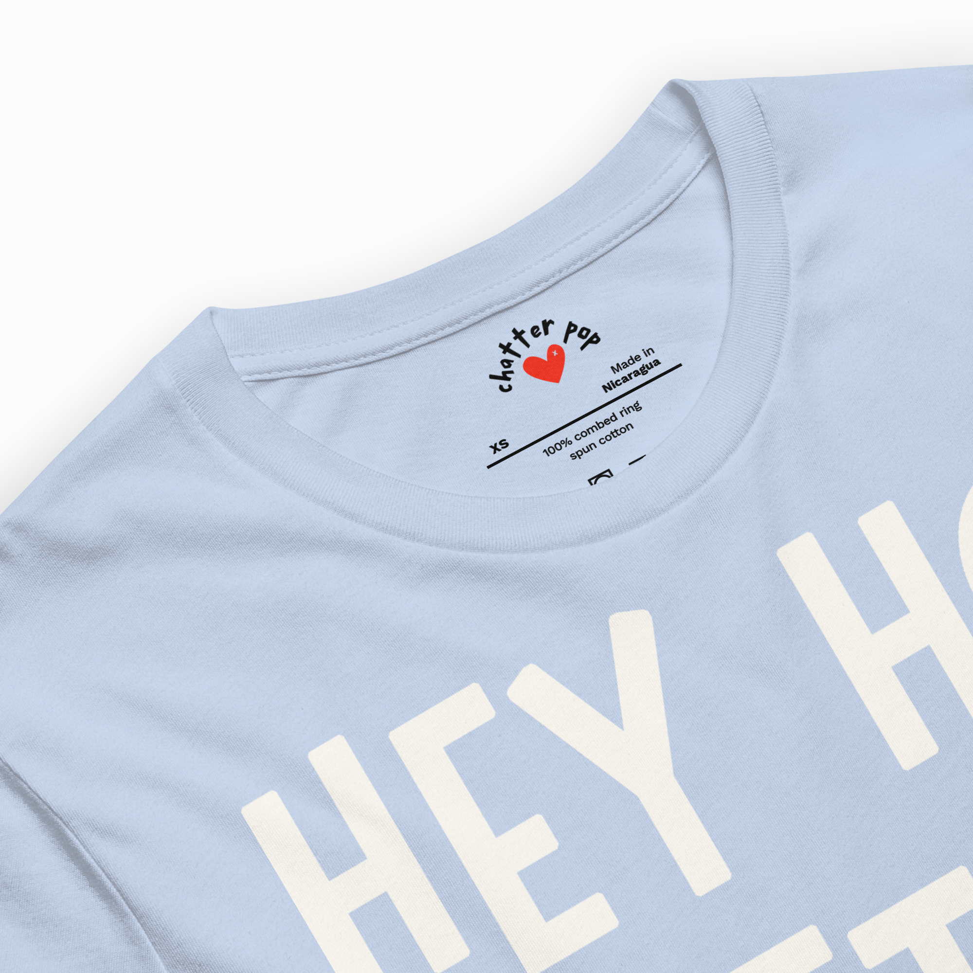 Light blue t-shirt with 'HEY' printed on it, featuring a brand logo.