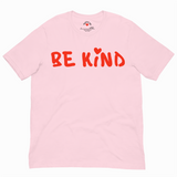 Pink t-shirt with 'BE KIND' text in red on a white background