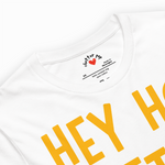 White t-shirt with yellow text and a visible brand logo on a white background