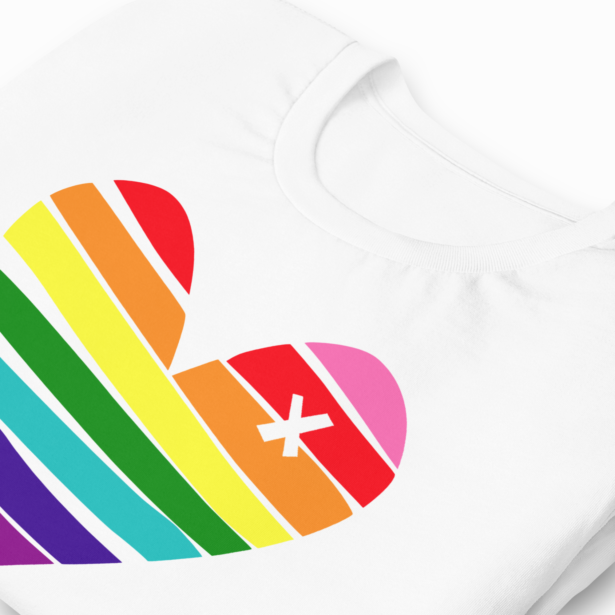 White t-shirt with a rainbow heart design featuring a white 'X' in the center.