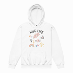 A white pullover hoodie with a front graphic that reads 'HUG LIFE' in black letters, surrounded by small colorful doodles including flowers, a crown, lightning bolts, a rainbow, stars, and a sun, shown on a plain white background.