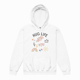 A white pullover hoodie with a front graphic that reads 'HUG LIFE' in black letters, surrounded by small colorful doodles including flowers, a crown, lightning bolts, a rainbow, stars, and a sun, shown on a plain white background.