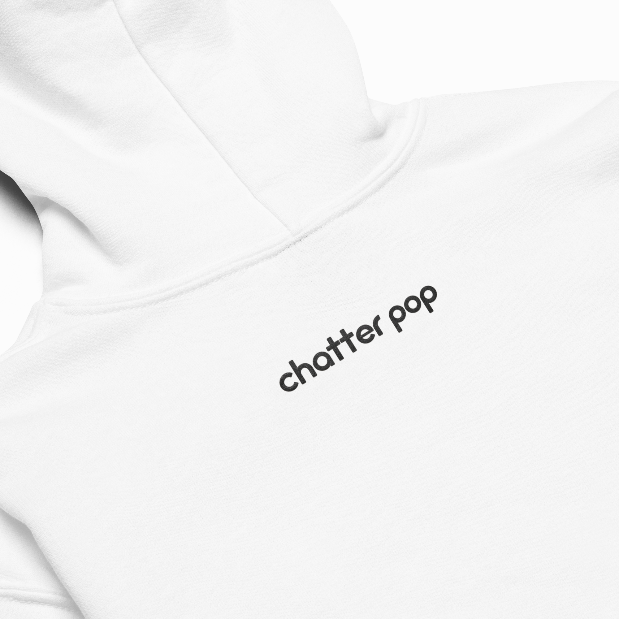 Close-up of a white hoodie showing the back with the text 'chatter pop' printed in black lowercase letters.