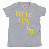 Gray t-shirt with yellow text 'HEY HO LET'S GO' on a white background