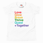A white short-sleeve crewneck t-shirt featuring a colorful text graphic on the front that reads 'Love Glow Brave Thrive Quest +Together' in a rainbow gradient. The inside collar shows the 'Better Together' logo and 'Made in Mexico' text.